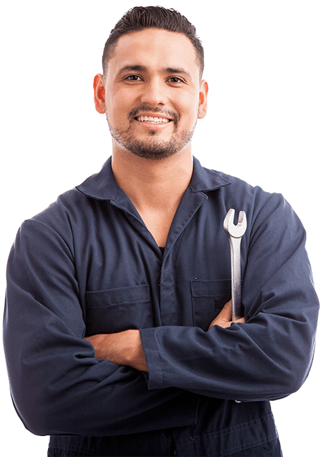 A mechanic smiling crossing arms while holding a wrench.